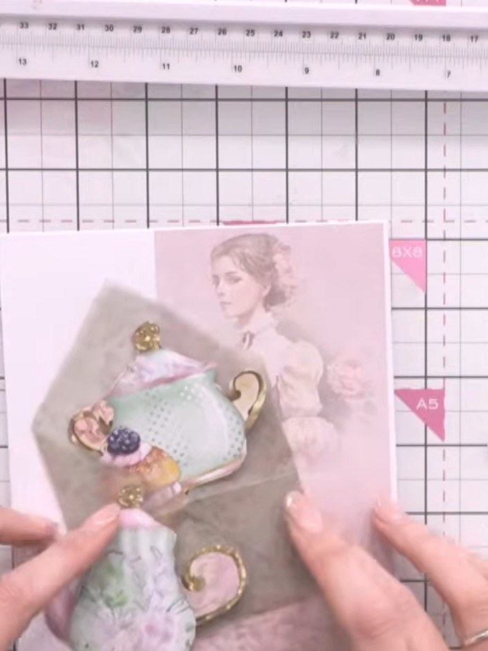 Step 10: Fussy cut decorative embellishments such as teacups, teapots and cake designs from the patterned papers. Arran
