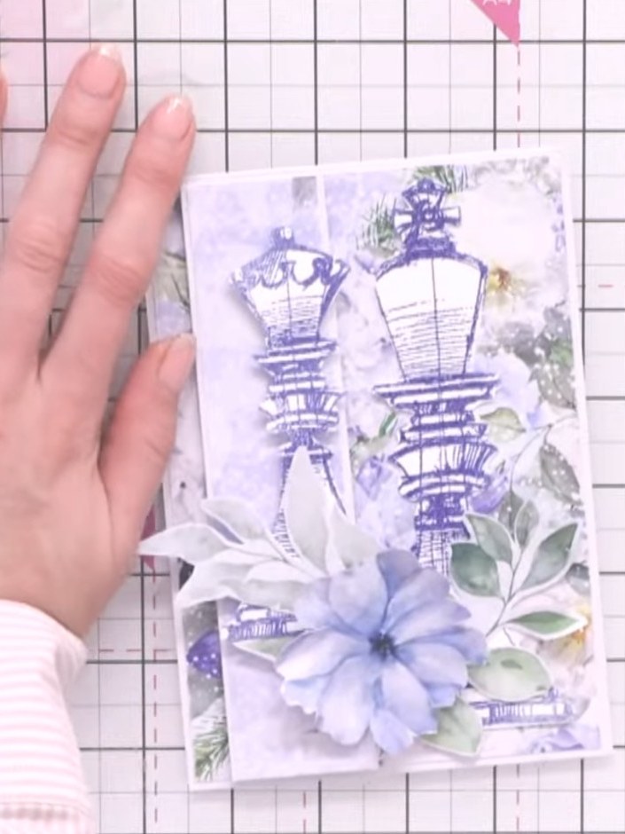Step 9: Position the completed card on your craft mat and smooth it down with your hand to ensure all elements are sec