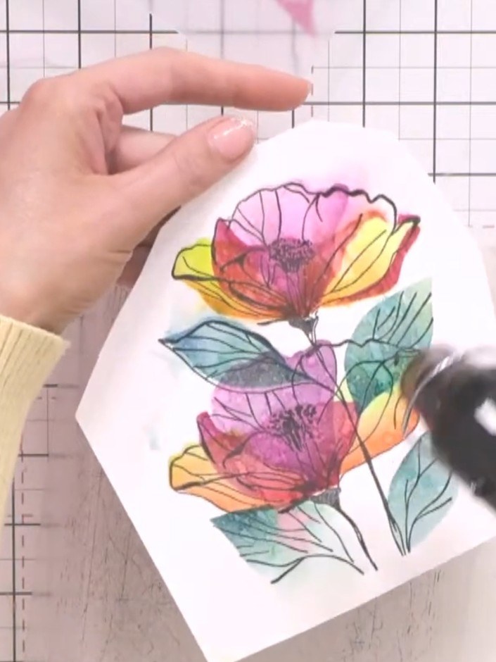 Step 10: Die-cut the stamped and coloured floral panel using your die-cutting machine to create the finished topper pie