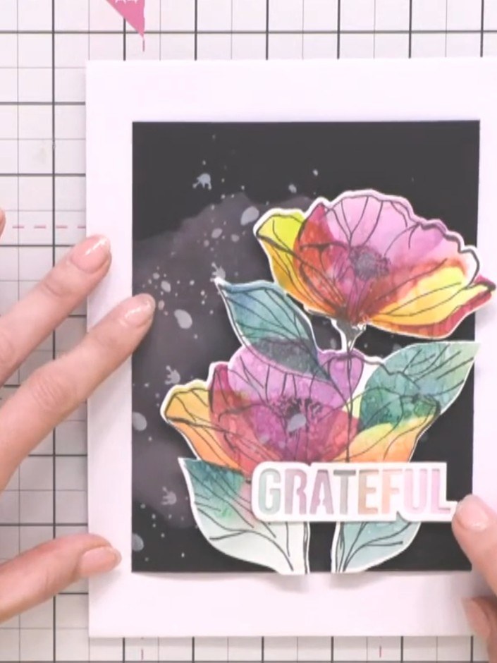 Step 13: Adhere the 'Grateful' sentiment panel to the right side of the black card to complete the design.