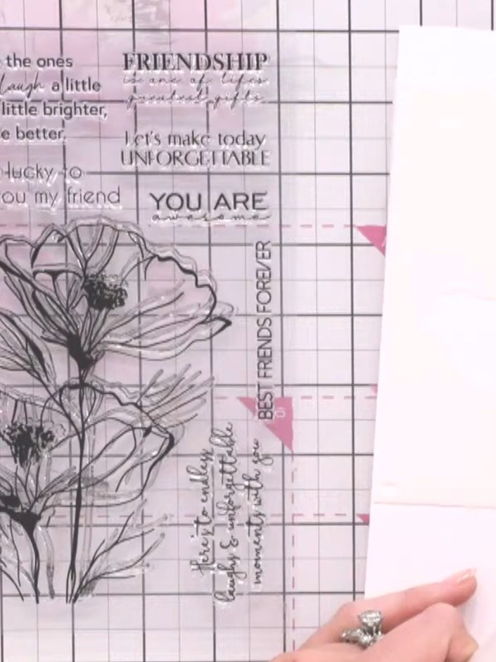 Step 2: Select stencil number two from the Radiant Poppies set and position it on your white card panel.