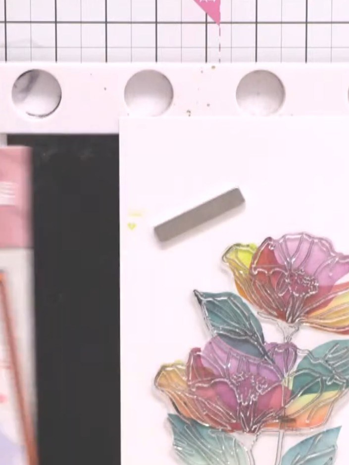 Step 8: Spray the completed background lightly with water to create a watercolour effect and soften the edges.