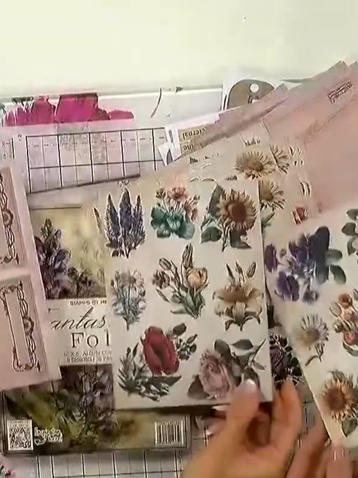Step 3: Arrange the cut-out floral images and sentiment pieces on your card base to plan your layout. Move the element