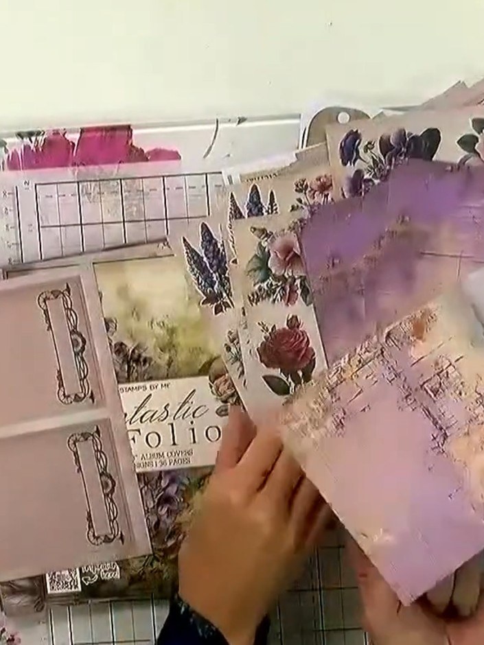 Step 4: Apply tape or glue to the back of each embellishment. Turn over your die-cut elements and decorative papers an