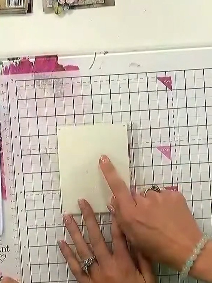 Step 1: Position layering stencil number one in the corner of your card blank on the magnetic glass mat.