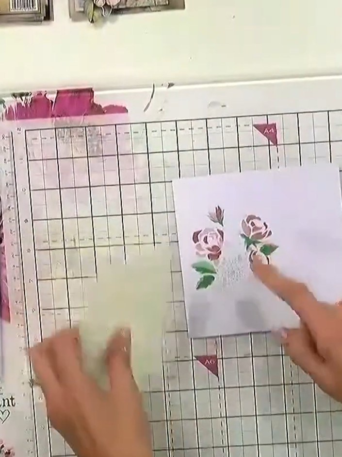 Step 2: Use a blending brush to apply coloured ink through the layering stencil onto your white card. Work the ink gen