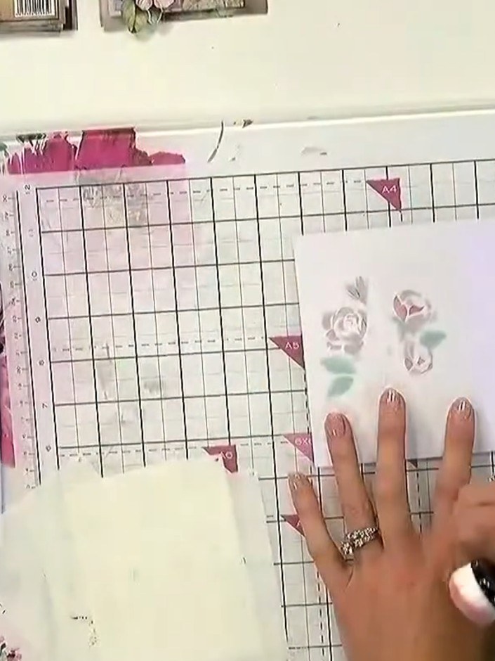 Step 3: Remove the first stencil carefully. Position the second stencil in exactly the same spot on your card, alignin