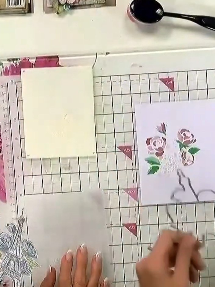 Step 5: Position the matching die around your stamped floral design on the lilac card panel. Ensure the die is centred