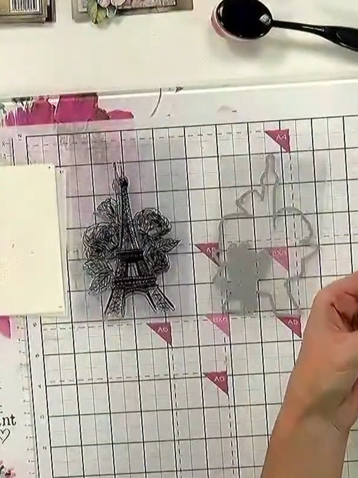 Step 1: Place your die-cut design piece or prepared card stock on the magnetic glass mat. Position a pink card blank o