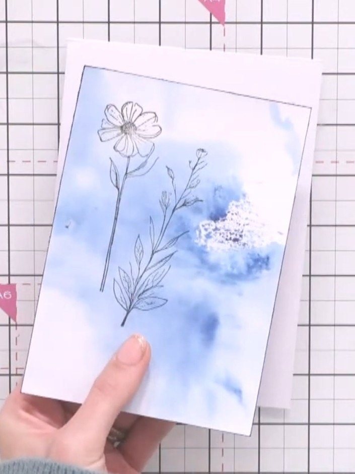 Step 3: Mount the stamped and watercoloured panel onto a white card blank, positioning it centrally with a narrow bord