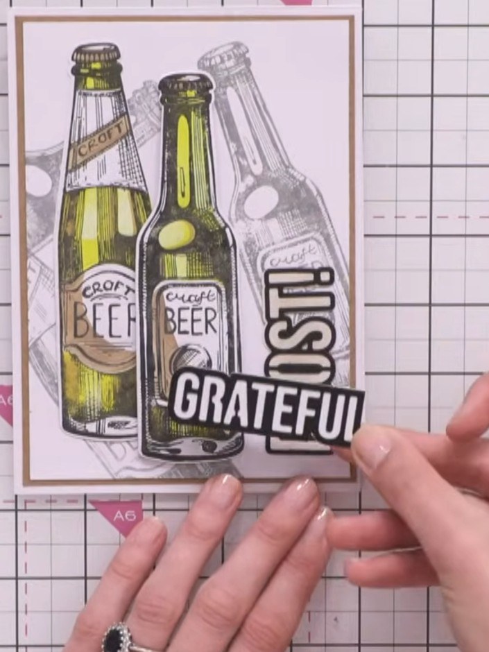 Step 7: Add a coordinating sentiment such as 'Cheers', 'Grateful' or 'Prost' to complete your card. Position the senti
