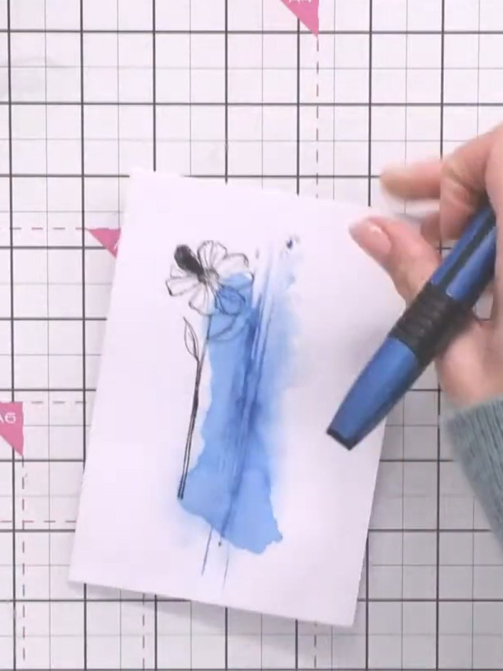 Step 1: Stamp a detailed silhouette image onto white card using a blue ink pad. Choose a floral or botanical silhouett