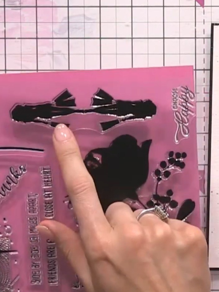 Step 12: Stamp a sentiment from your stamp set onto watercolour card and trim to size. Add a black ink swipe across the