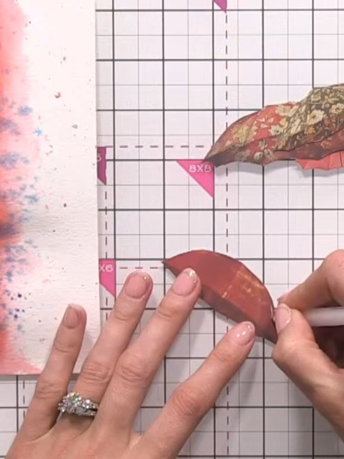 Step 8: Use a white gel pen to add highlights to the umbrella shapes, creating dimension and detail on the patterned p