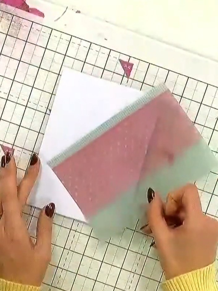 Step 2: Select a piece of vellum from the kit with a design you like. Place it on your magnetic glass mat to hold it i