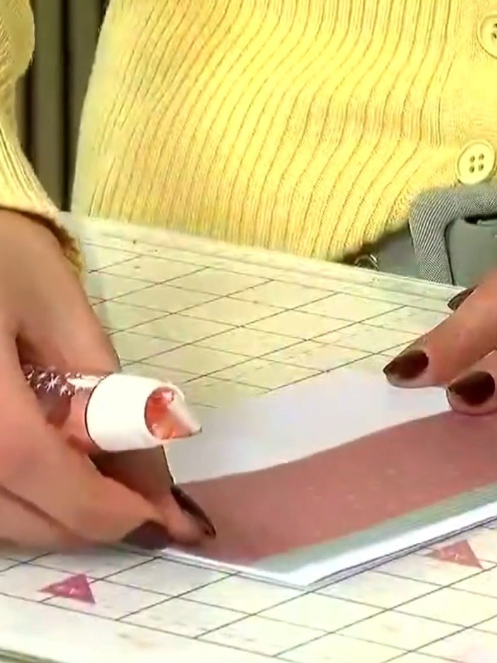 Step 4: Position the vellum strip down the side of your card base, aligning it neatly with the edge. The vellum should