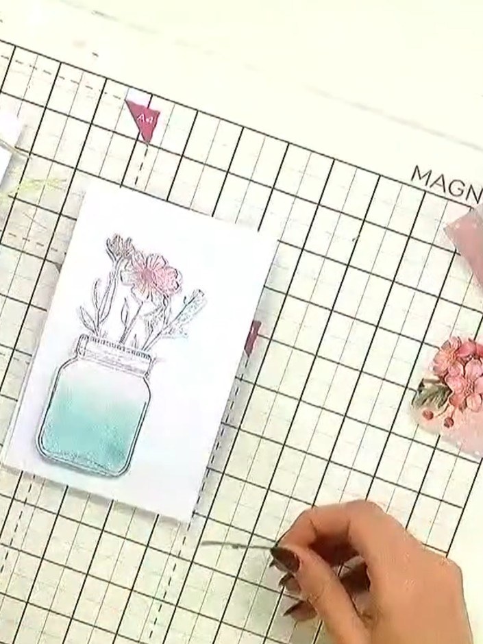 Step 5: Select faux flowers and embellishments from the pack. Choose pieces that complement your colour scheme - pink 