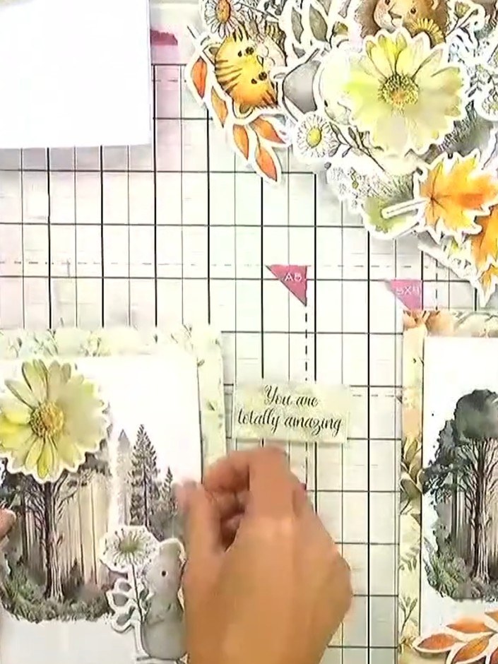 Step 11: Add a sentiment topper to the card by placing it under one of the foam pads at the top of the design. Alternat