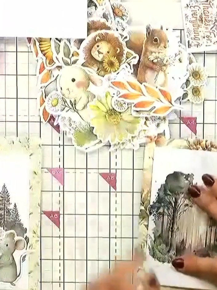 Step 5: Add filler florals or leaves around the animal elements using foam pads for dimension. Layer the yellow flower