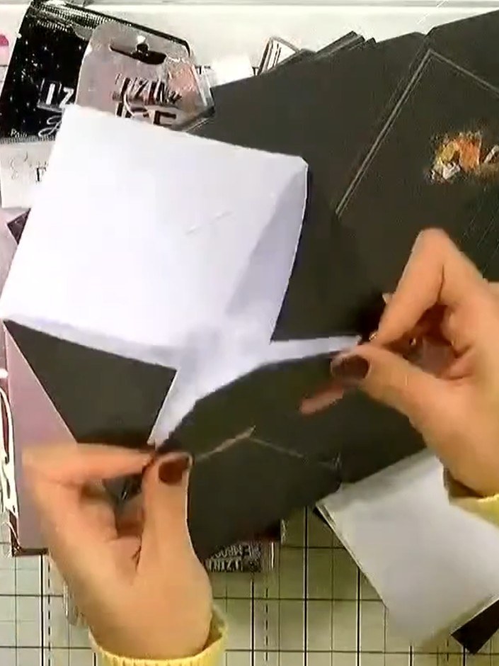 Step 4: Remove the card from the embossing folder and observe the raised, textured finish on the dark green card. The 