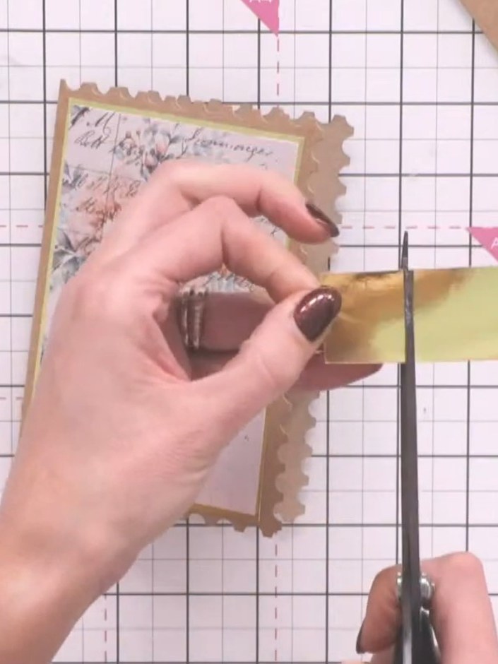 Step 8: Cut a strip of gold cardstock approximately the same length as the card width. Attach this belly band to the i
