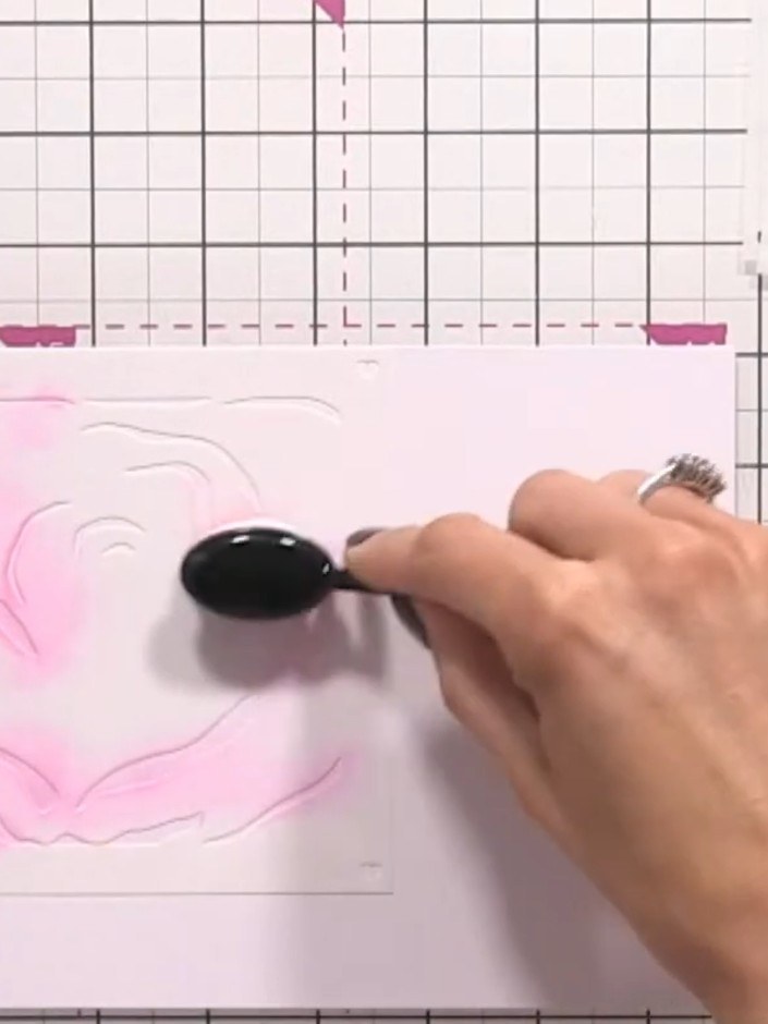 Step 2: Apply pink ink through the rose stencil using a blending brush, building up the colour lightly to create the f
