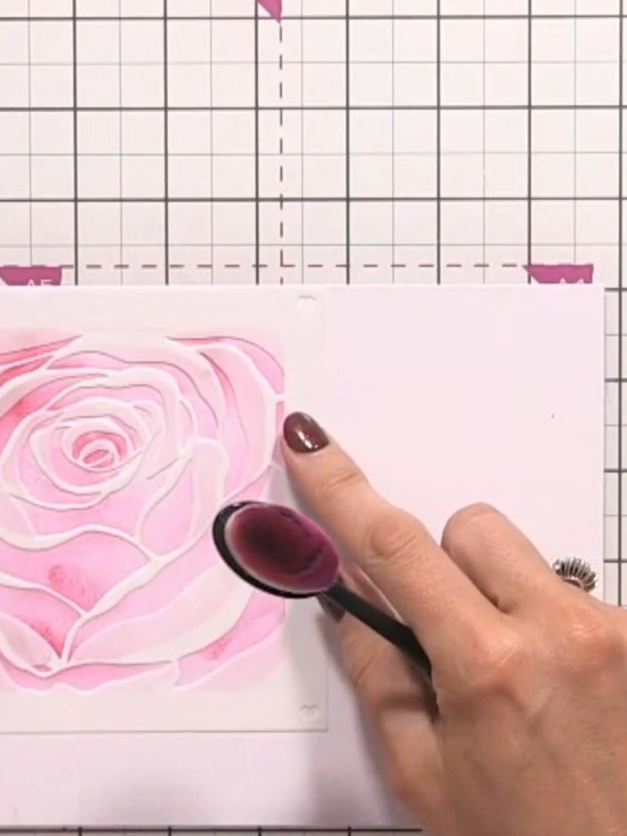 Step 5: Position the fourth and final stencil layer over your card and apply pink ink using a blending brush to comple