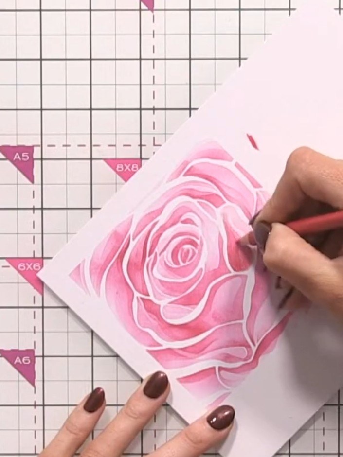 Step 8: Add darker tones to specific petal areas using a darker pink pencil, varying your pressure to create depth and