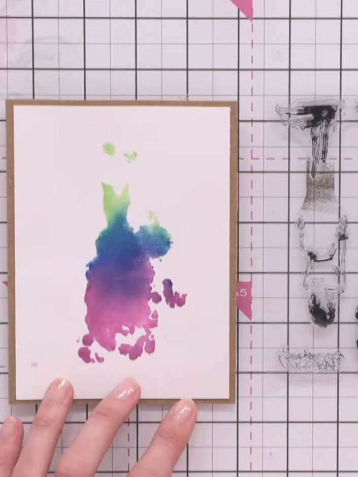 Step 4: Align the detail stamp layer over the dried watercolour base. Use the positioning guide on the back of the sta