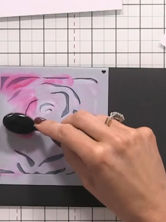 Step 8: Position stencil number two over your design and apply pink ink through the stencil using a blending tool to a