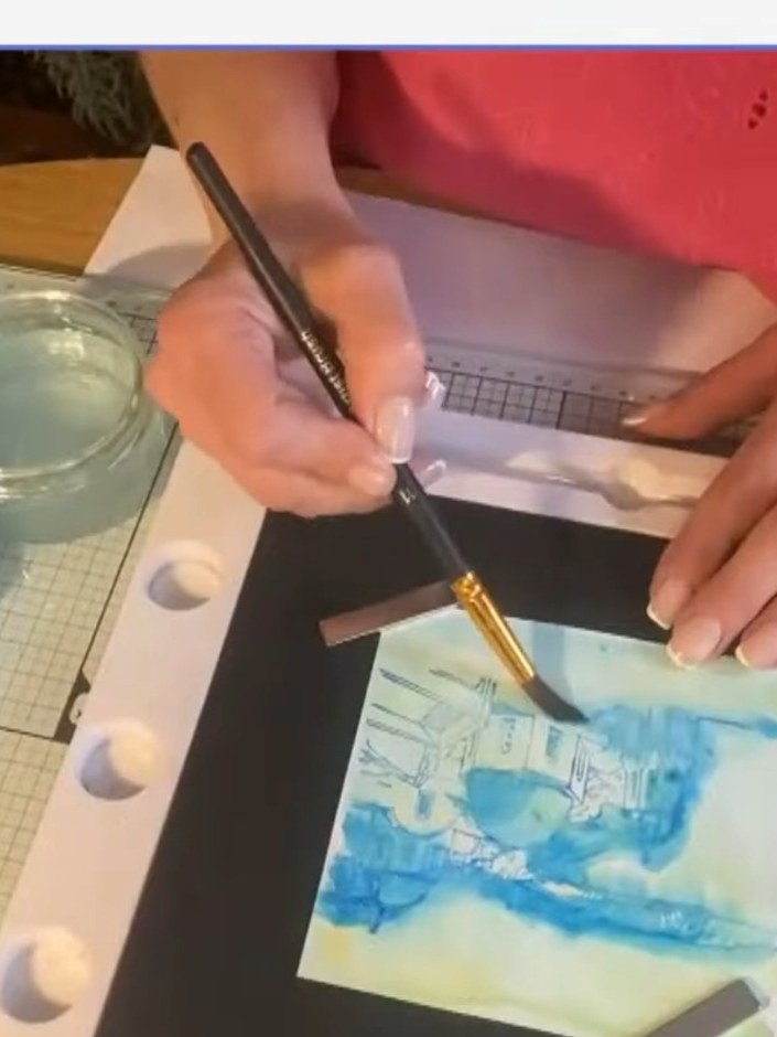 Step 4: Using a water brush, add extra water lines beyond the blended blue area to help the colour seep further into t