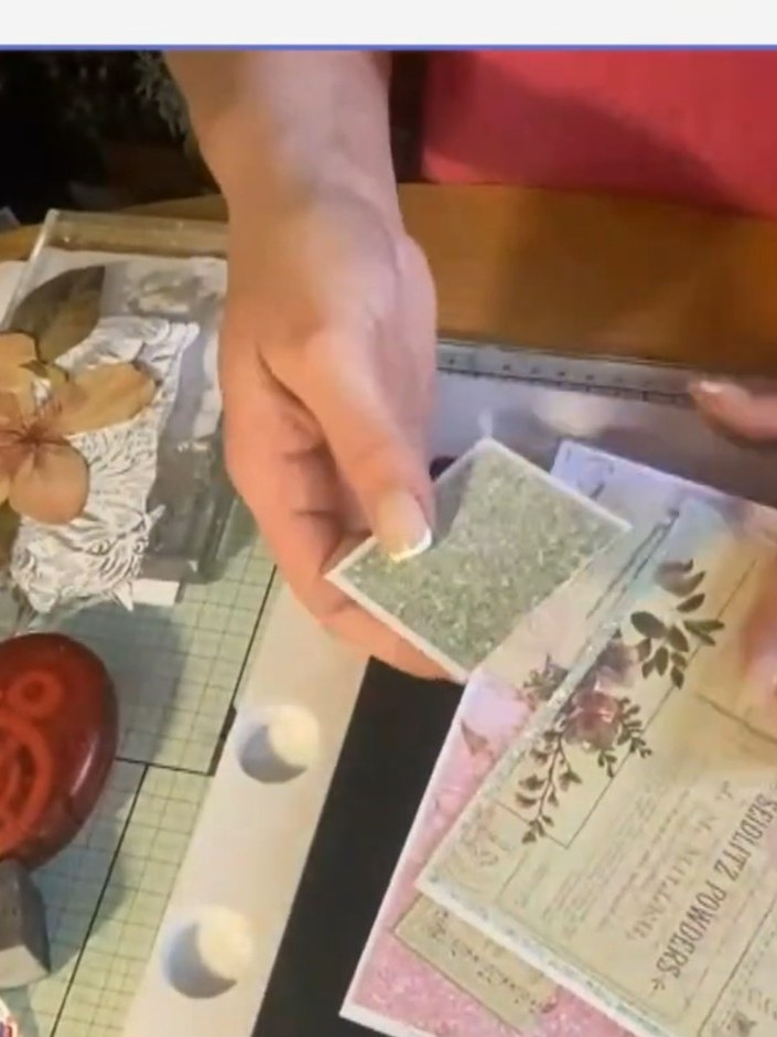 Step 6: Layer the floral elements onto your card base using foam pads to create a 3D effect. Position the fussy-cut fl