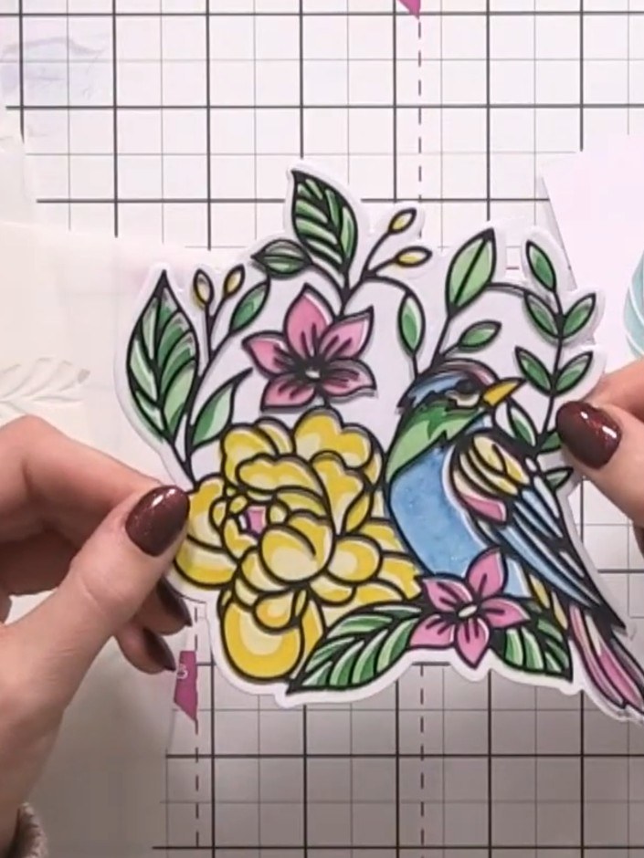 Step 6: Layer the black detailed die-cut piece on top of your coloured stencilled bird to create a 3D effect. Position