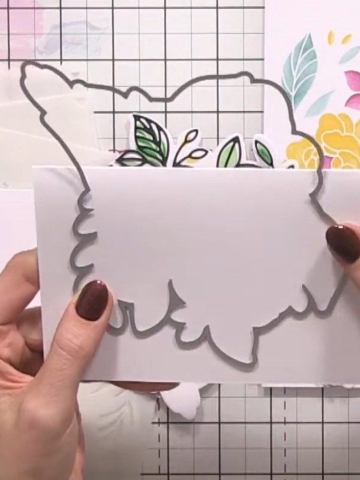 Step 8: Adhere your complete shaped bird piece to the back of the card blank, ensuring it aligns seamlessly with the d