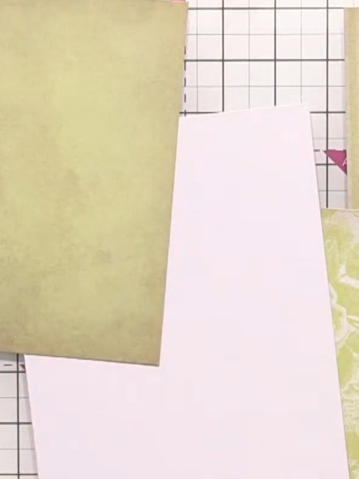 Step 3: Arrange the three cut panels on your white card blank, layering them to create visual interest. Position the g