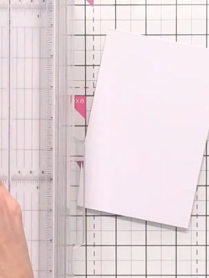 Step 4: Secure each pink panel to the card base using double-sided tape or adhesive. Position the panels on the white 