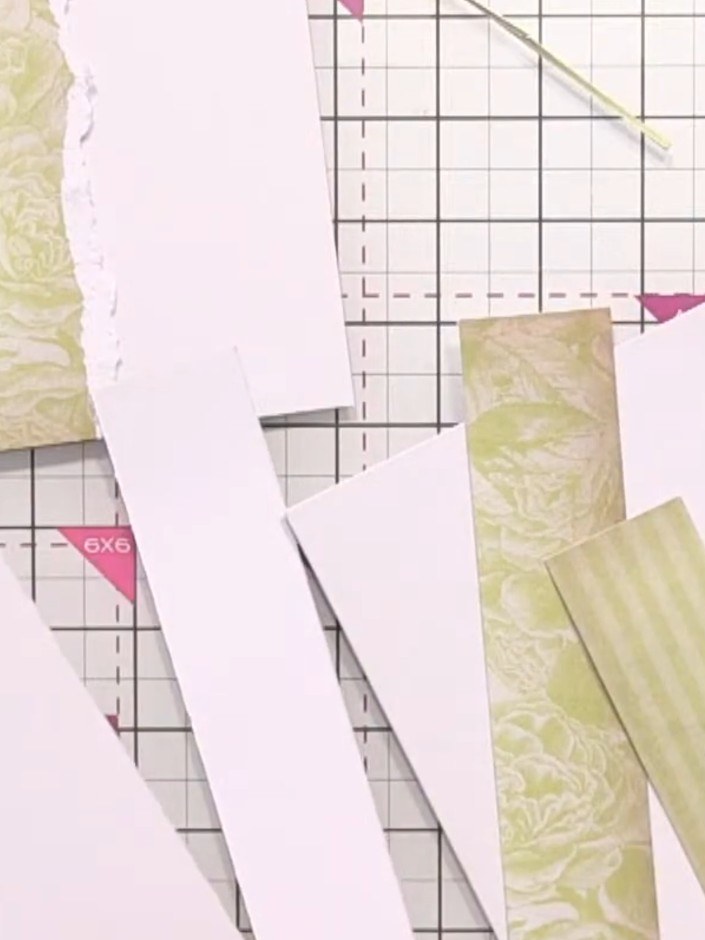 Step 2: Arrange the white card strips horizontally on your card blank, leaving gaps between each strip to create a lay
