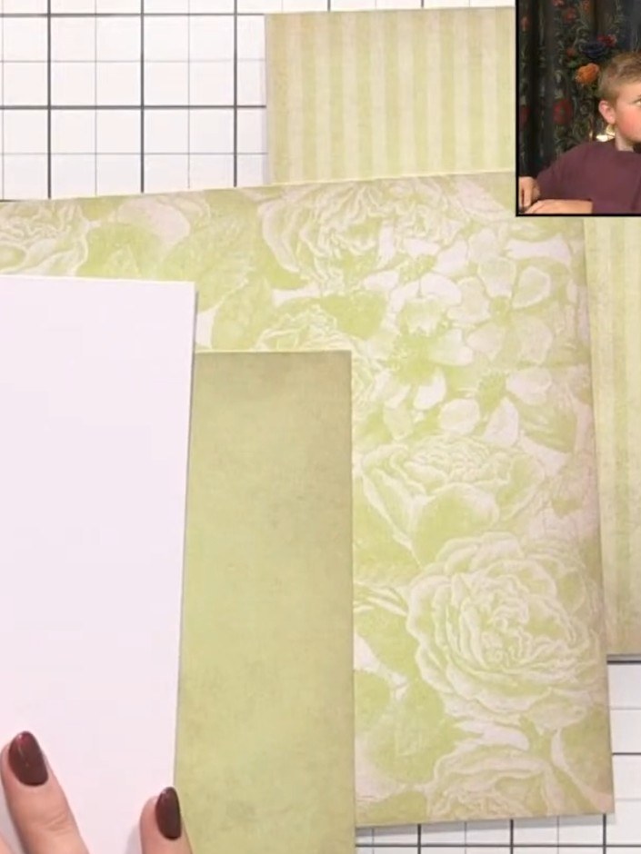 Step 3: Position the second stencil layer over your card and apply the same green ink, pressing more firmly to create 
