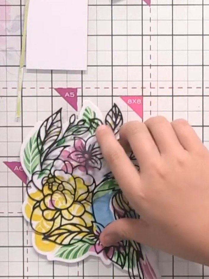 Step 5: Die-cut the coordinating black outline using the included die. Carefully position and place the black outline 