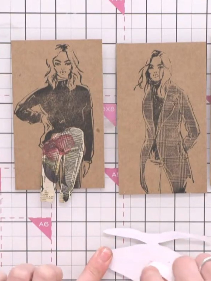 Step 8: Arrange three fashion illustration cards in a row on your craft mat. Position a patterned paper breaker from t