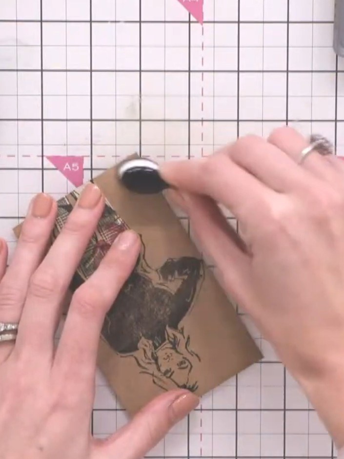 Step 9: Use a blending brush to apply brown ink around the edges of the patterned paper pieces on your fashion illustr