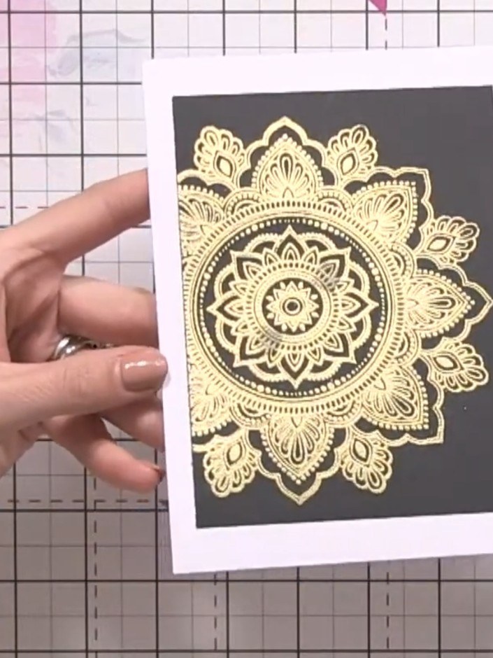 Step 1: Stamp the Serendipity mosaic design onto black card stock using gold ink. Heat emboss the stamped design to cr