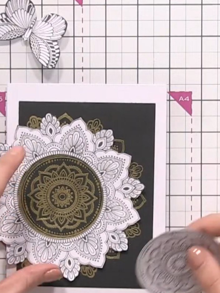 Step 3: Use a circular die cut to cut away the centre of the embossed mandala design. Position the die over the white 