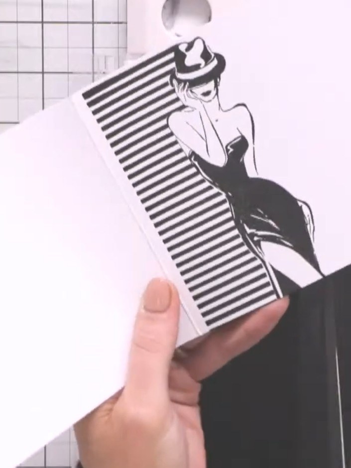 Step 2: Carefully cut around the lady's outline with scissors, leaving a small white border to create a shaped card ed