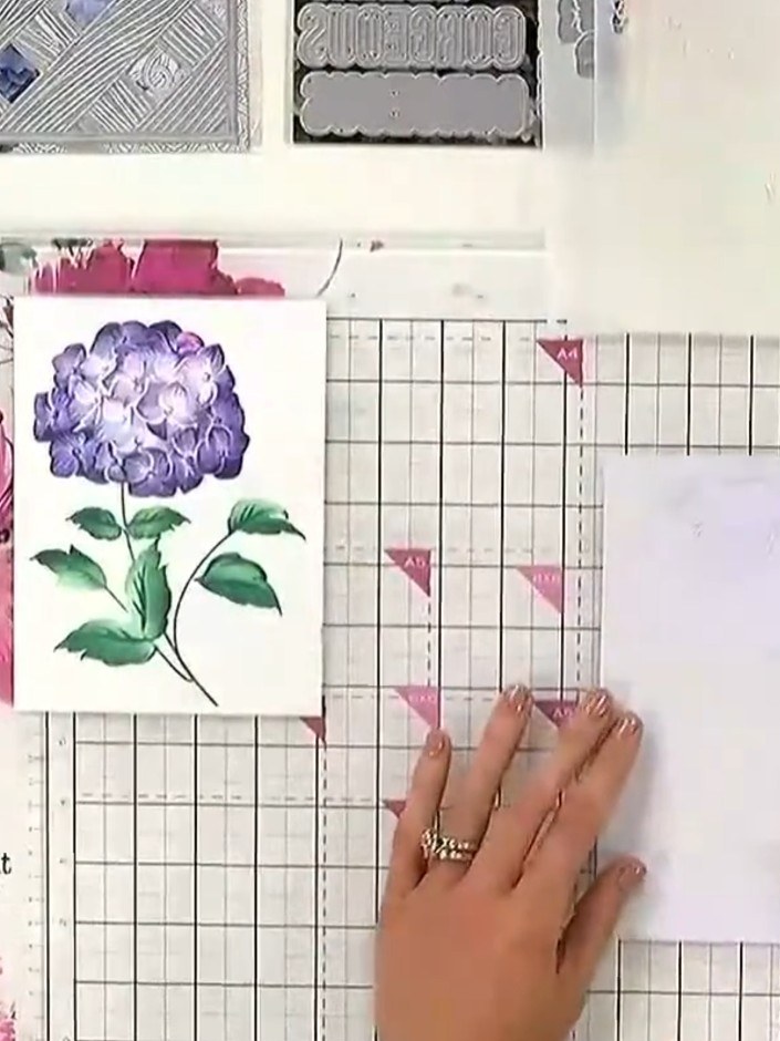 Step 1: Position stencil number one on your card base, aligning it with the edge. Use the heart registration marks in 
