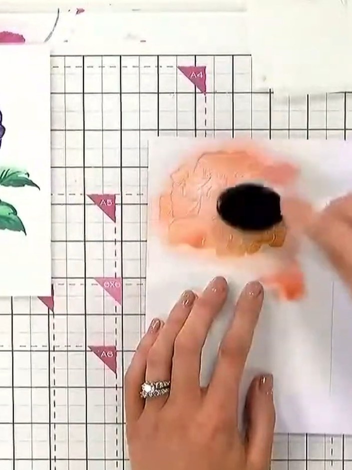 Step 2: Tap off excess ink from your ink pad. Using a sponge or blending brush, blend yellow and orange ink through th