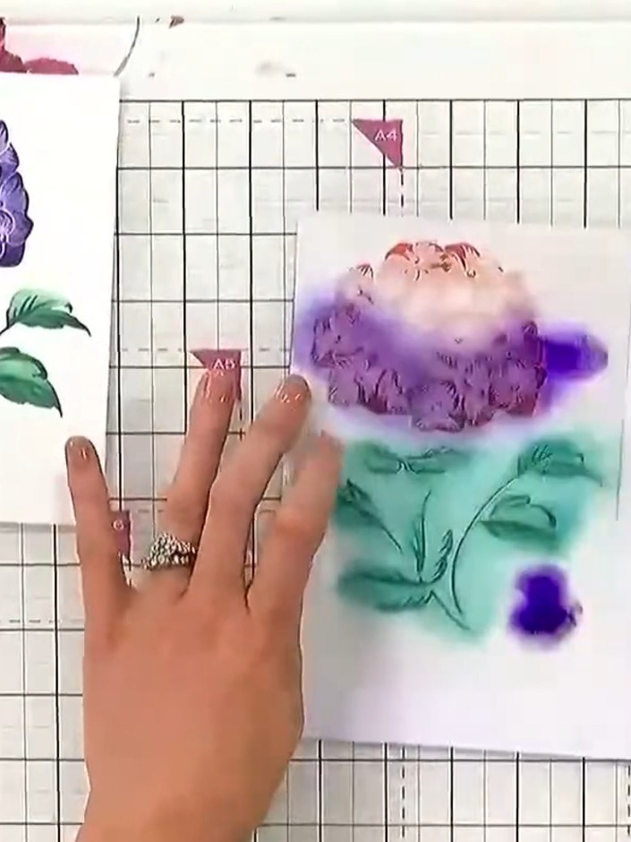 Step 9: Layer the stamped hydrangea flower, green leaves, and sentiment onto your white card base using foam pads to a
