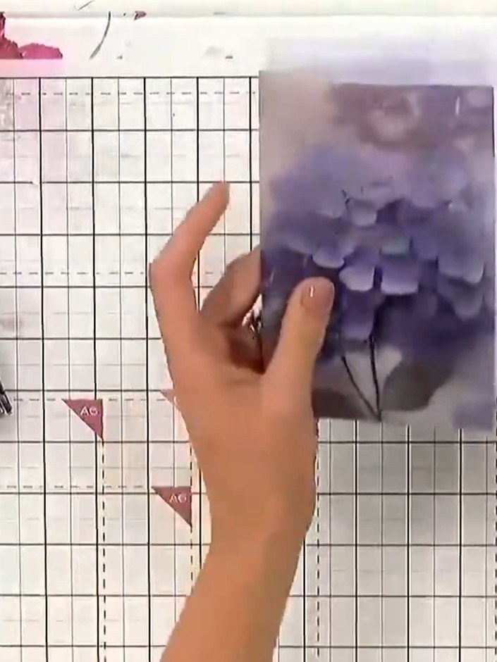 Step 2: Attach the torn vellum panels down the side of your card base using a tape pen, which shows through less than 