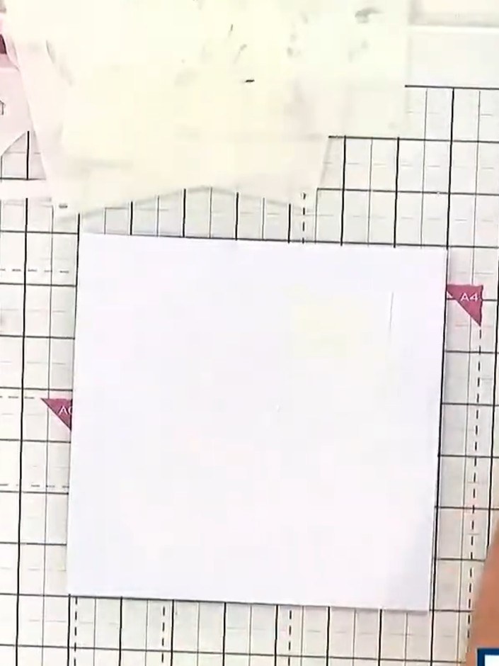 Step 1: Take a square card blank and position it on your craft mat. Line up the magnolia stencil with the edge of the 
