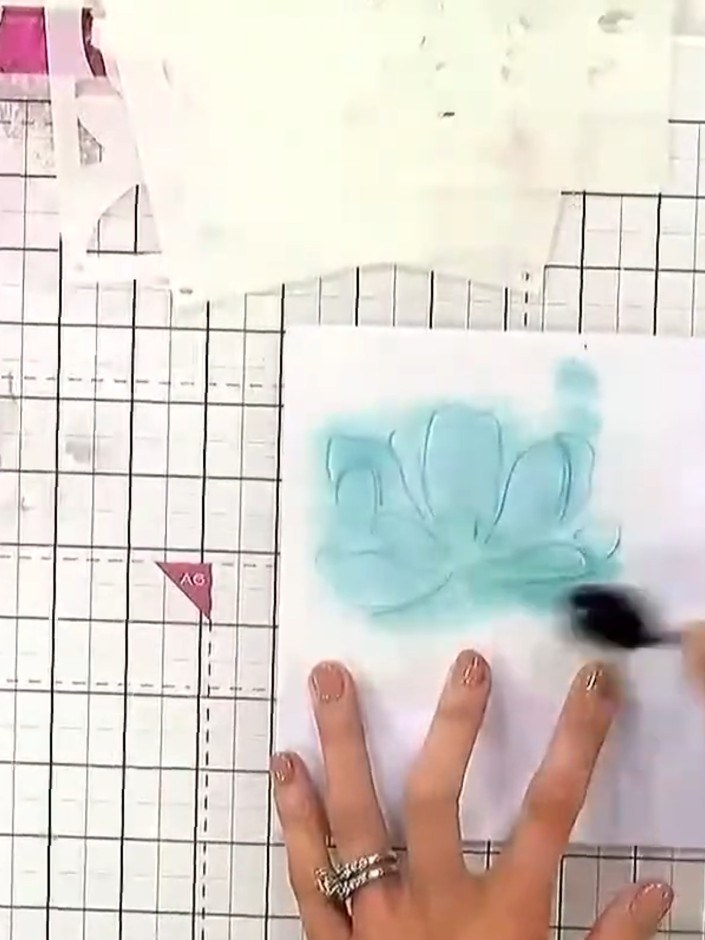 Step 2: Apply your first ink colour (teal) through stencil number one using a sponge or brush, building up the colour 